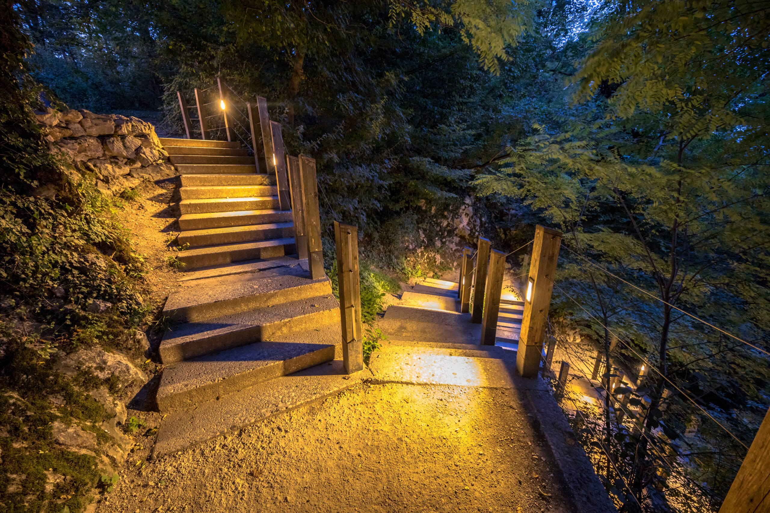 Garden steps lit by warm lights along the railing, an example of low-voltage LED landscape lighting in the San Fernando Valley