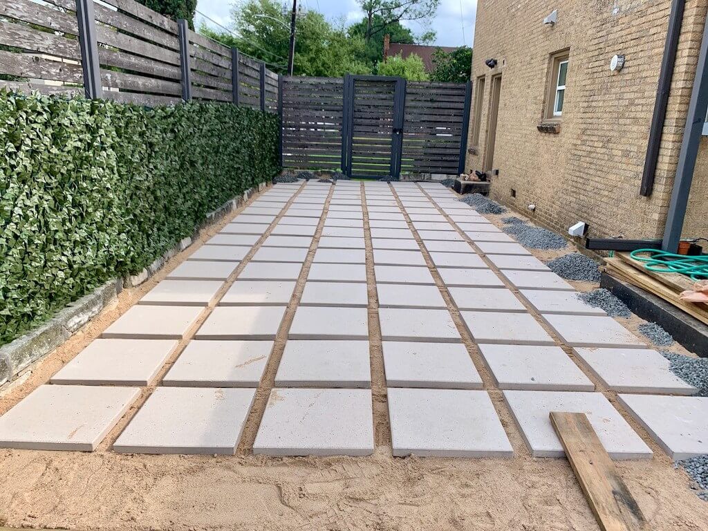 Hardscape patio laid with large white limestone concrete pavers in the San Fernando Valley